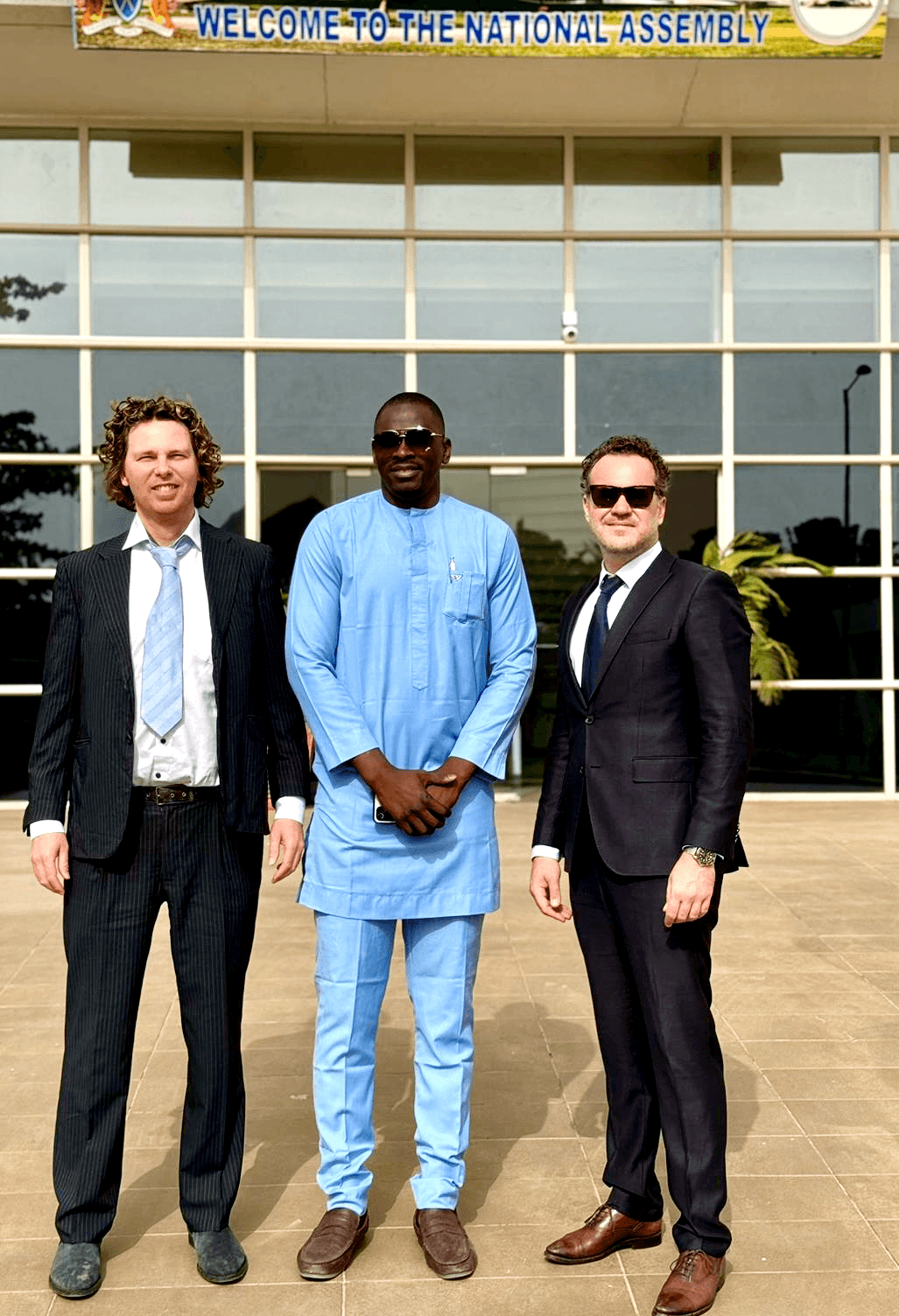 f.l.t.r.; Roger Modderkolk, deputy majority leader Hon. Abdoulay Ceesay, Aurus CEO Guido van Stijn in front of The National Assembly